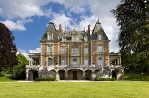 Front façade of Château de Bouffémont with manicured French gardens