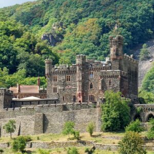 Gothic-revival Burg Reichenstein above vineyards on the Rhine River