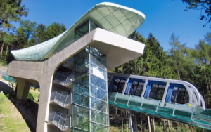 Futuristic glass funicular car of Innsbruck Hungerburgbahn at steepest point