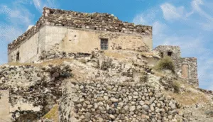 Covered archaeological site of Akrotiri with ancient walls and pathways