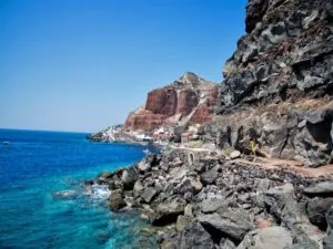 Candle-lit Agia Anna cave church cut into volcanic rock at Vothonas
