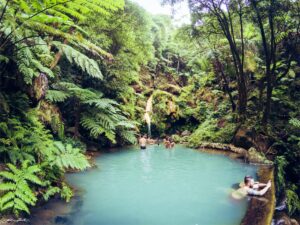 Natural iron-rich thermal waterfall at Caldeira Velha nature reserve
